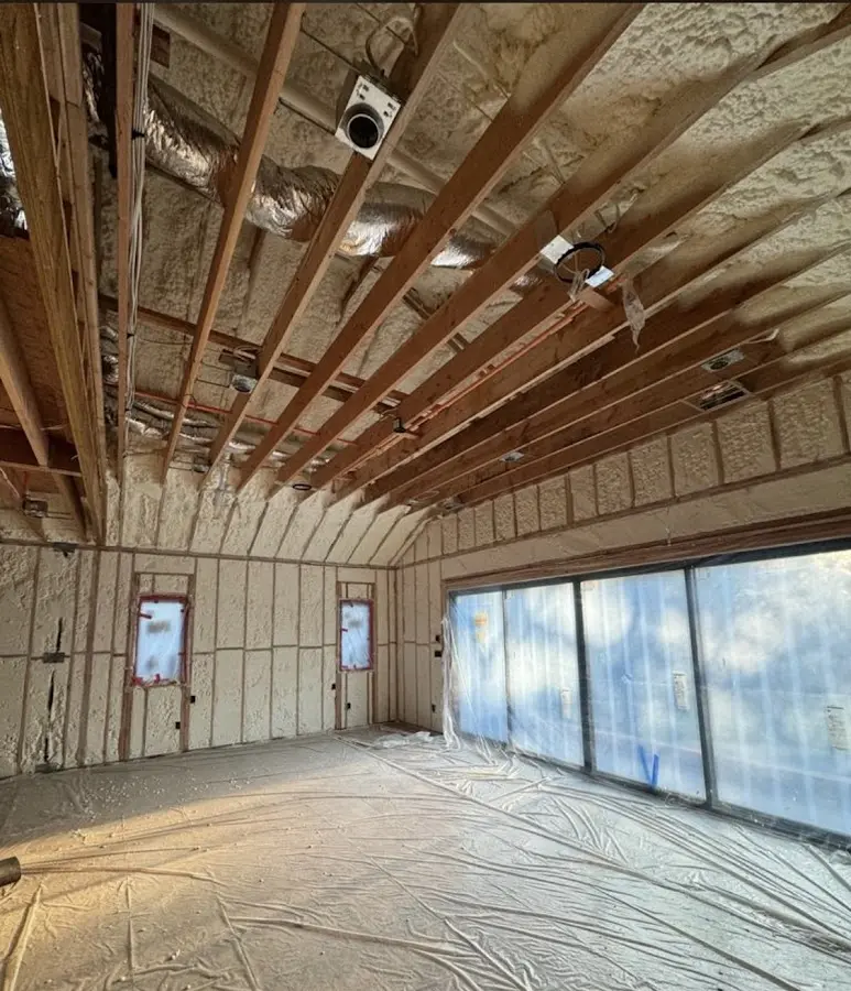 Interior walls and ceiling insulated with spray foam during new construction in Mayville